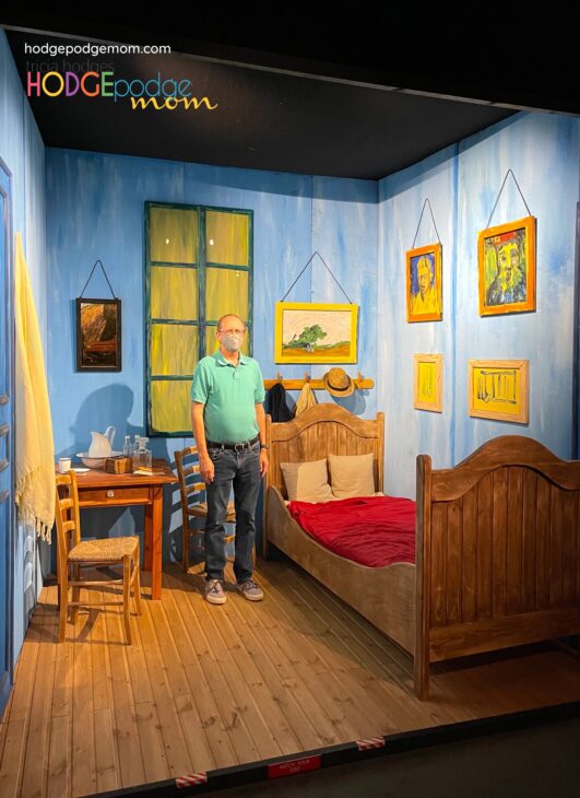 An interactive exhibit of Van Gogh's Bedroom at Arles at the Van Gogh Immersive Experience. 
